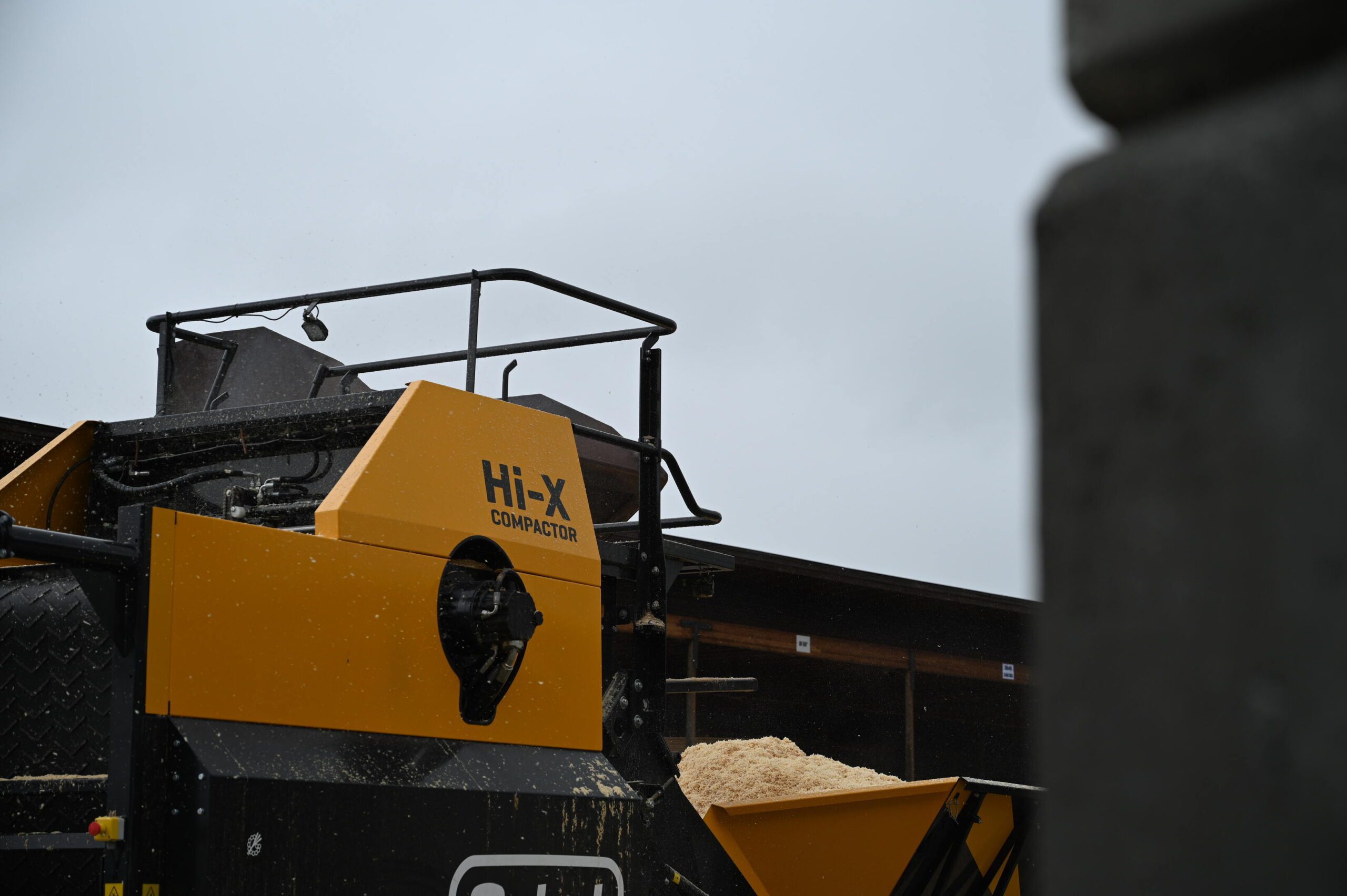 The platform and railings of the Hi-X compactor with grey skies in the background.