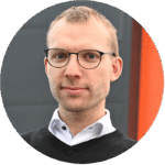 Closeup portrait of a man with a grey and orange background