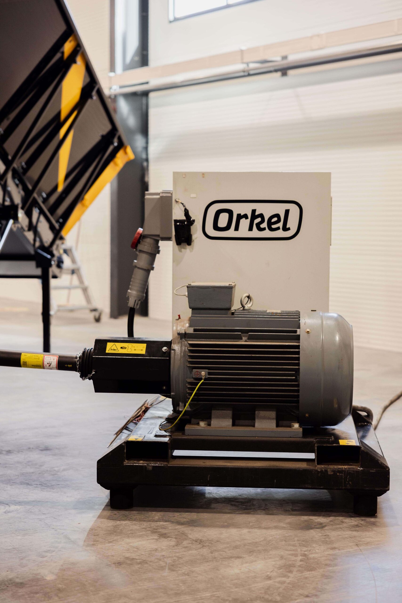 An electric Orkel powerpack located in a factory building